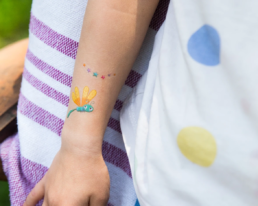 Child dragonfly tattoo