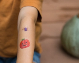 Child spider tattoo